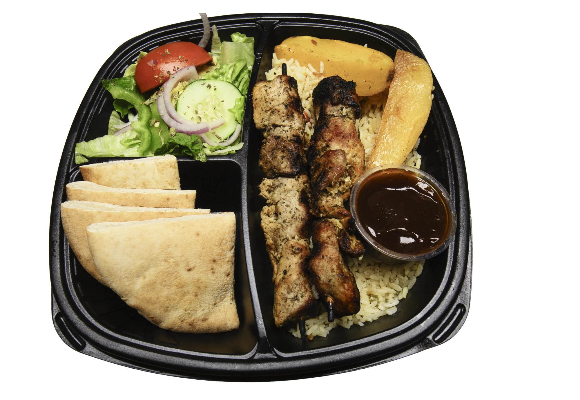 Healthy Kabob plate with grilled kabob, rice, pita bread, salad, roasted vegetables, and sauce